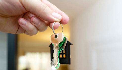 handing over new home keys