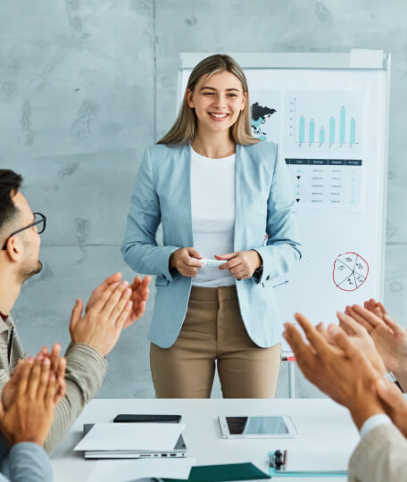 team applauds successful presentation