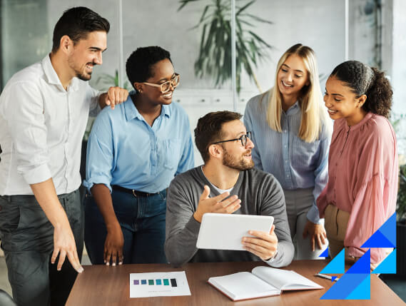 diverse team collaborating around tablet